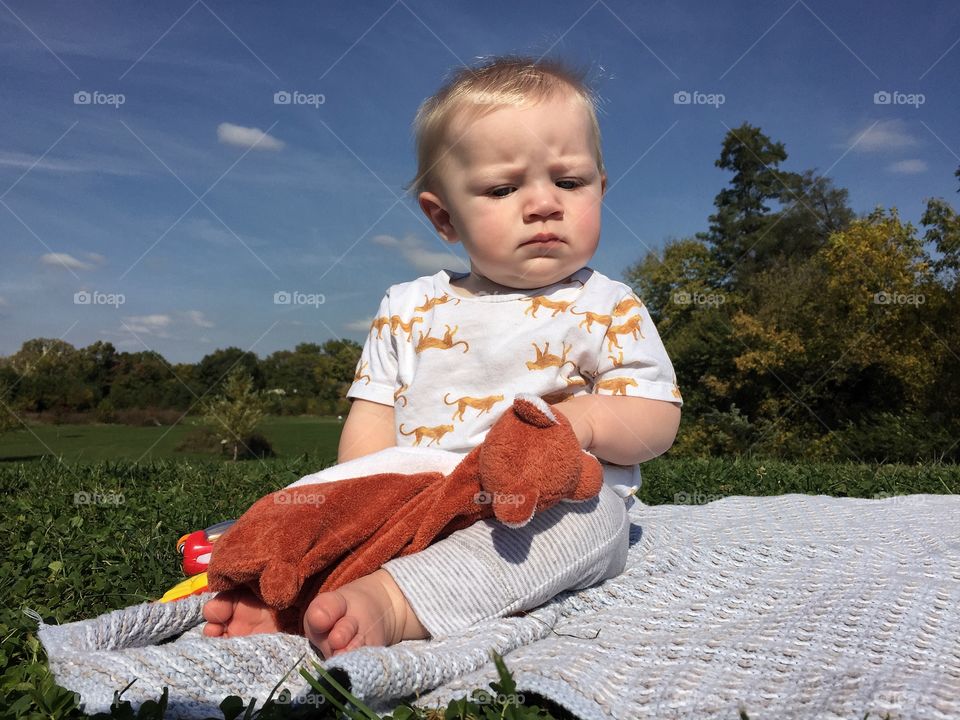 Cute baby boy playing outside