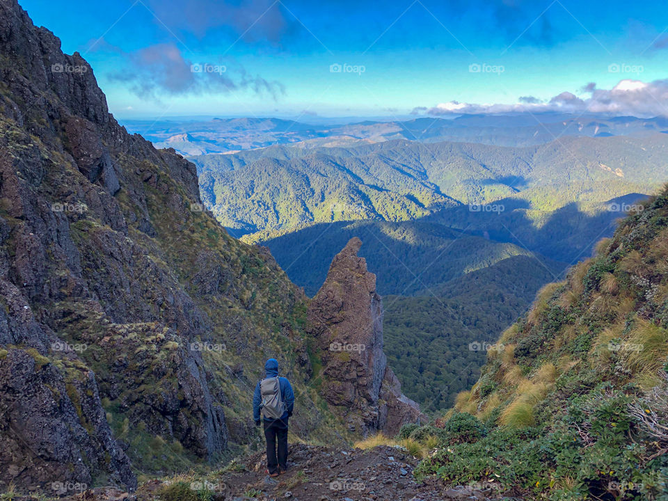 Descending from the top of the Mt Hikurangi peak and taking a moment to enjoy the view