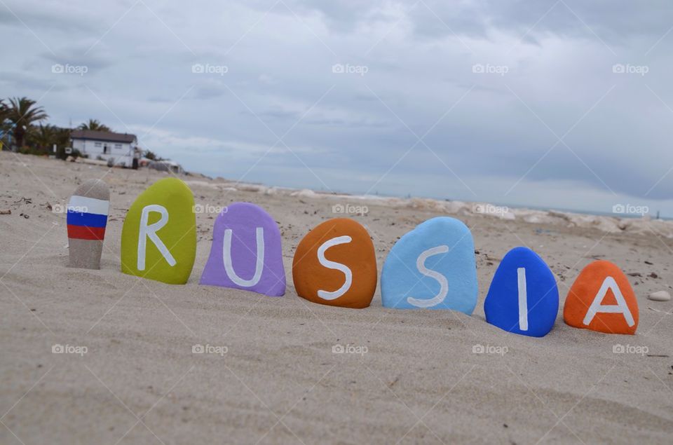 Russia with national flag on stones