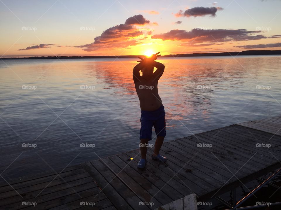 Kid in the sunset. A picture of my kid in the sunset at lake Roxen