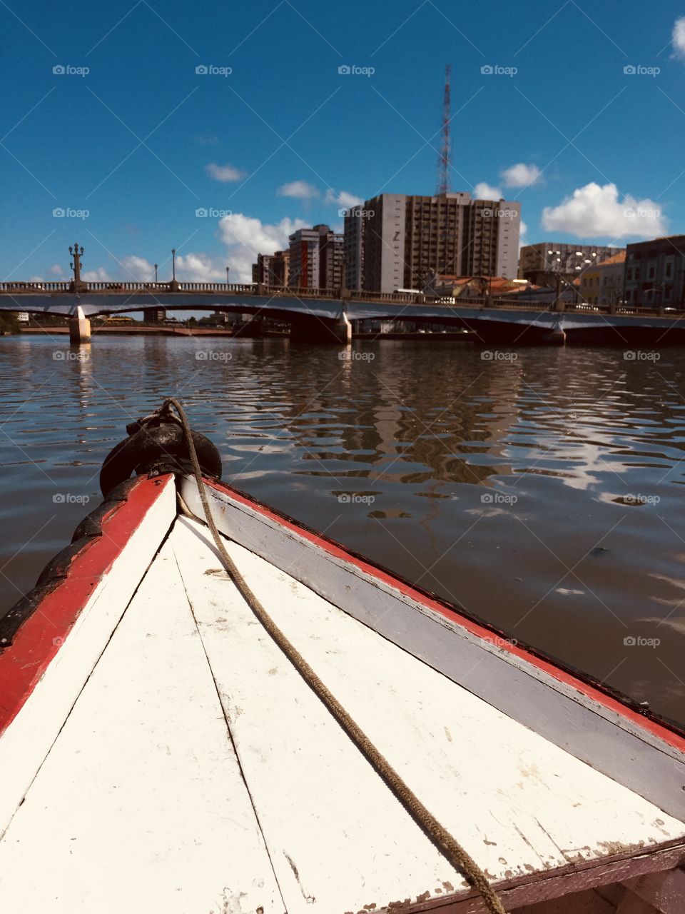 Tour in a boat in Recife, Pernambuco, Brasil, also known as the “Brazilian Venice” city. Beautiful landscape with historic buildings and diverse culture.