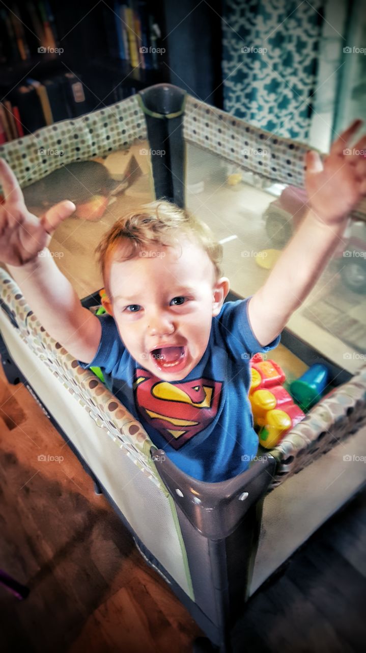 a boy wearing a Superman shirt and Ready To Fly!