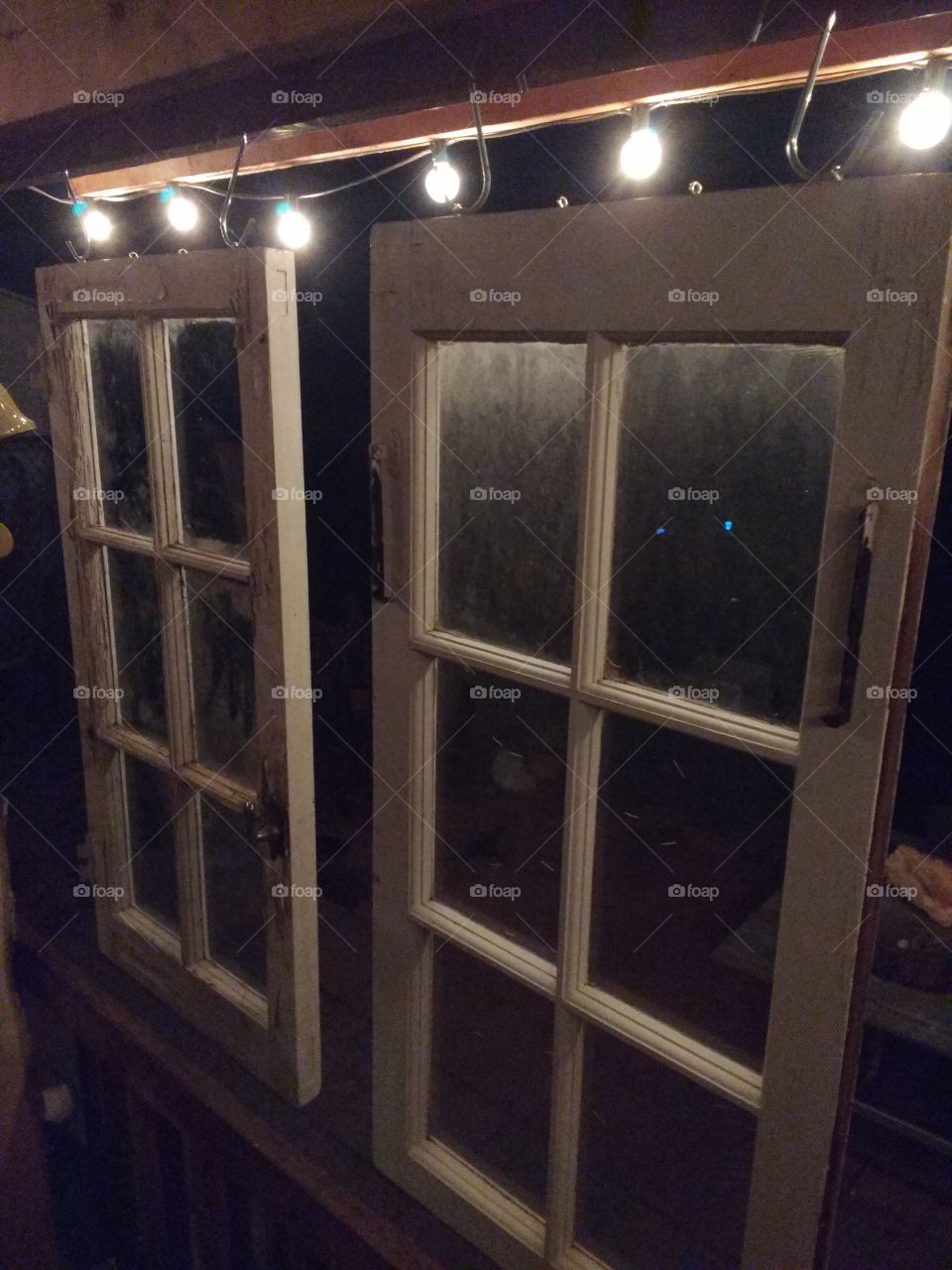 Vintage antique windows hanging on my back porch