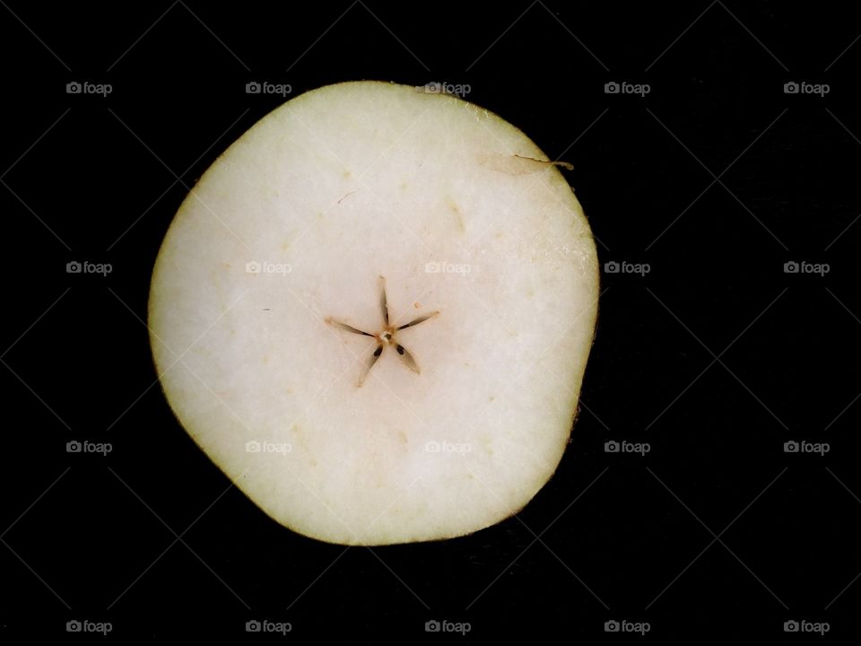 Peace of pear isolated on black 