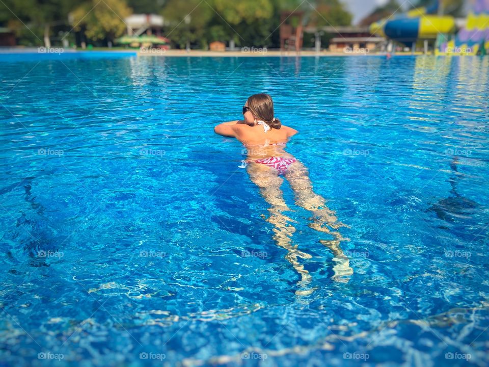 Woman swimming in the pool