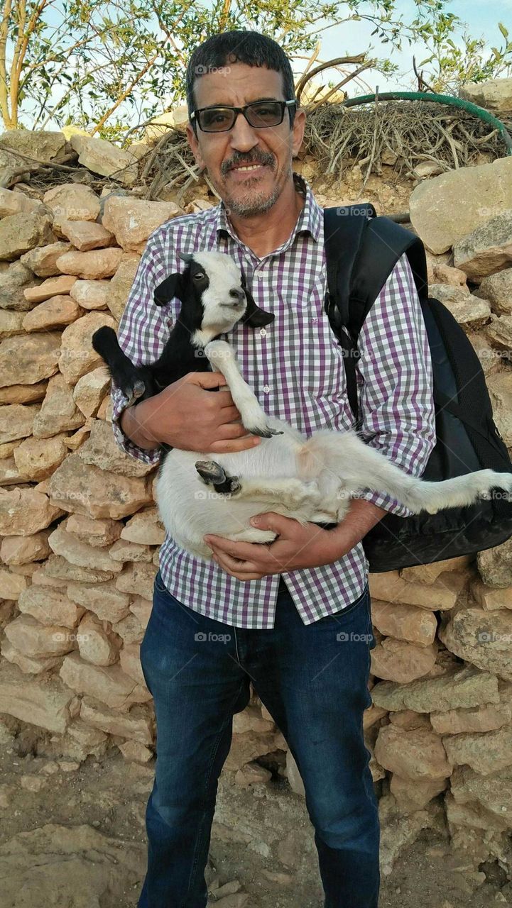 I m holding little goat