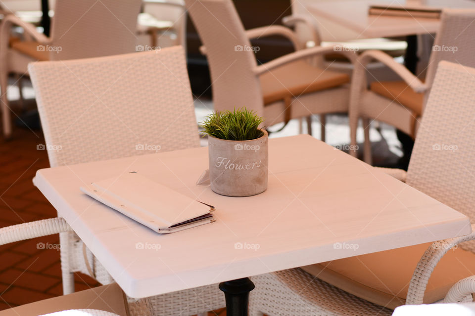 Flowers on the white table. Flowers in a restaurant, photographed in Szeged Hungary