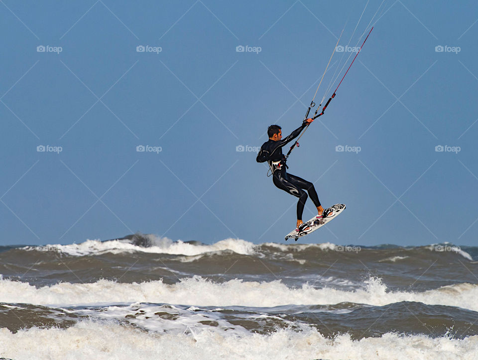 Kite surfer jumping high