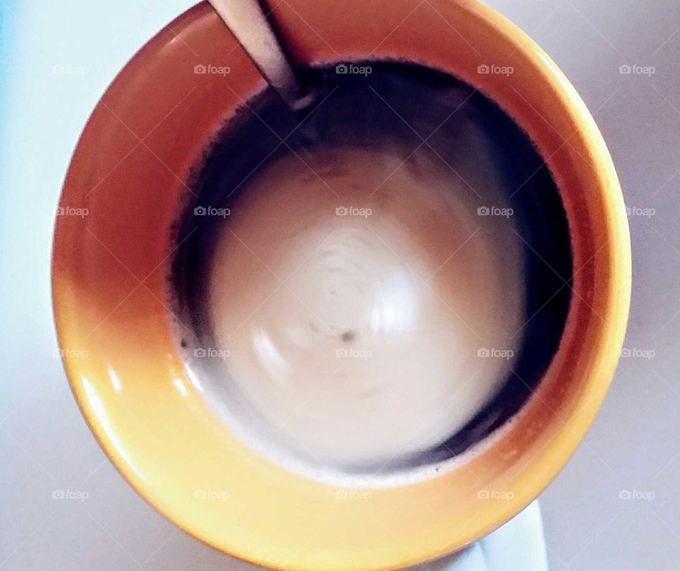 Coffee with Sugar Stirred w a Spoon