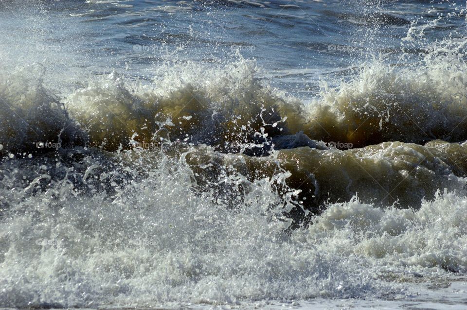 Waves. Waves crashing  on beach at west bay Dorset 