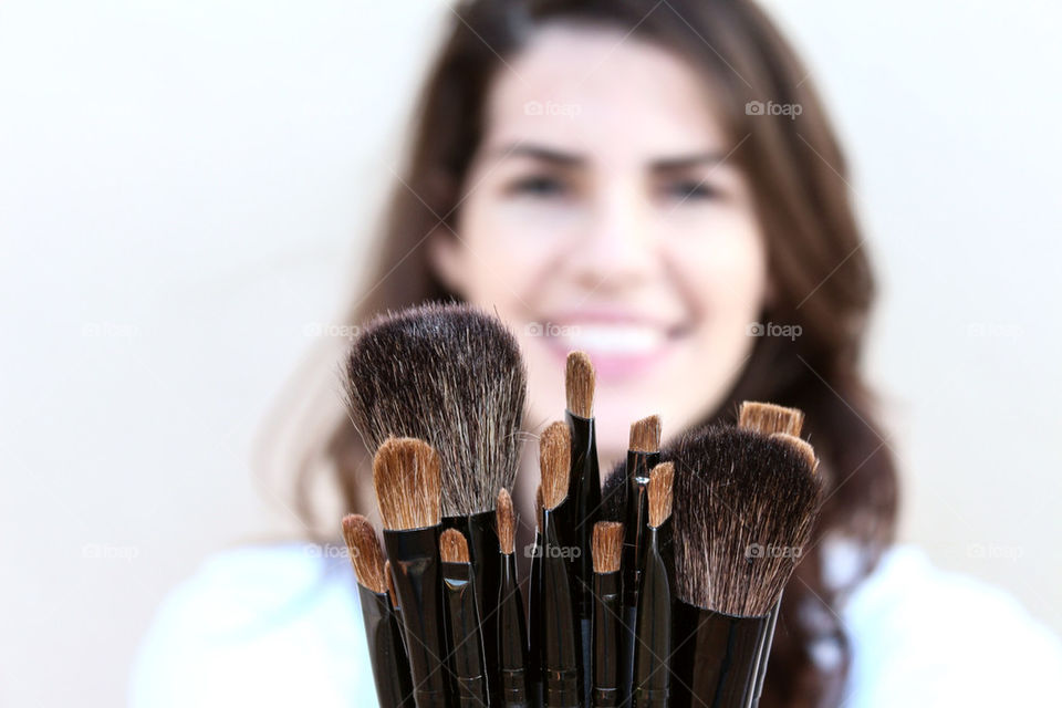 Girl showing her new makeup brushes