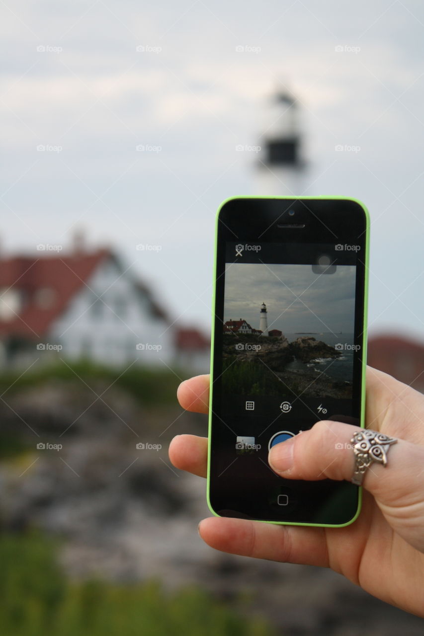 Through another Lens. I snapped this photo of my wife taking a photo of the infamous Portland Head Light.