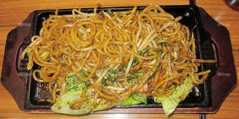 Japanese Yakisoba, Noodles on Wood and Cast iron Plate