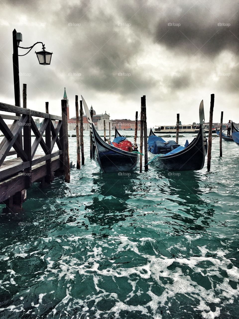 Venice. Thunder Sky. Gondolas on the pier near the Doge's Palace