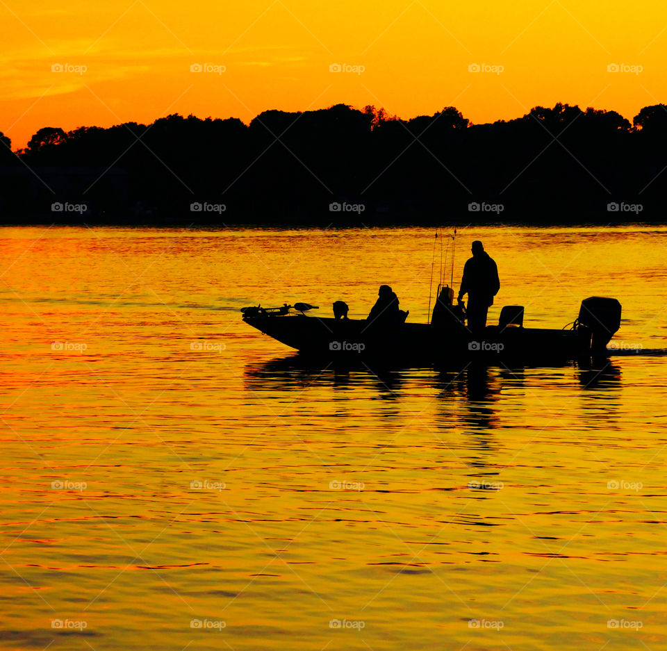 Fishing in the sunset!
Fishermen are on their way out of the bayou for a night of fishing!