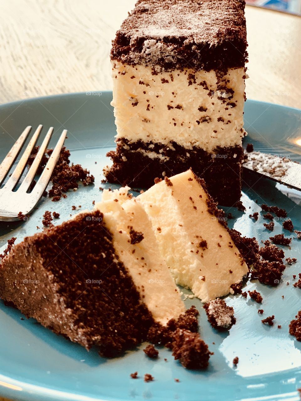 a cake with chocolate biscuit and souffle filling on a blue plate