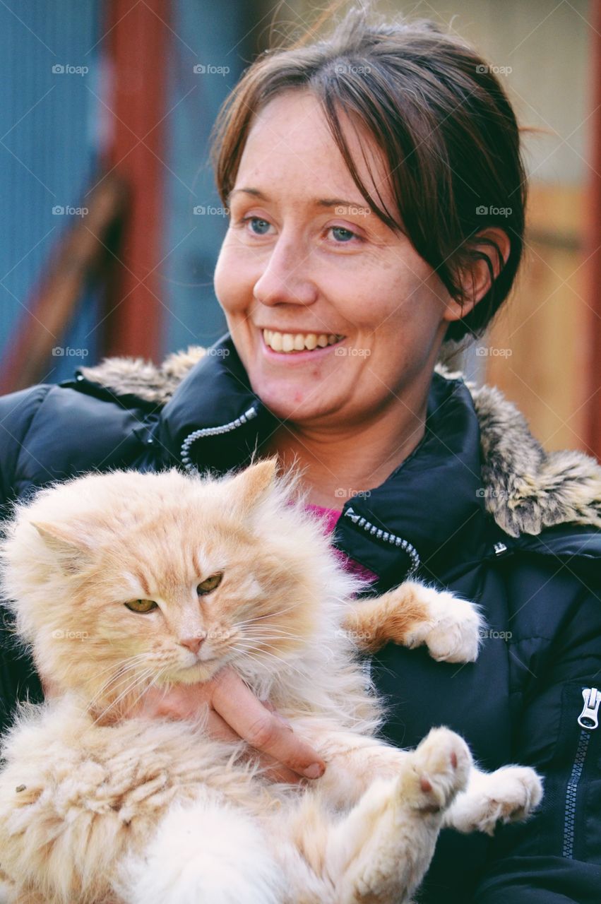 Happy woman with a fluffy cat