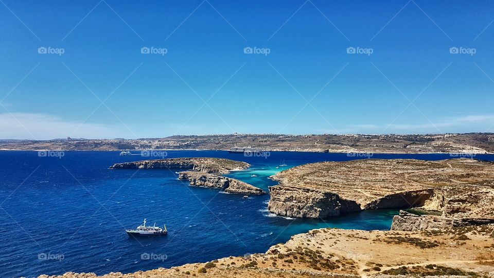 Maltese Blue Lagoon view from far away with ship nearby