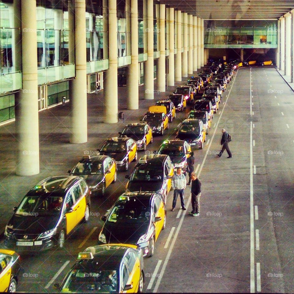 need a taxi?. long line of taxis in barcelona airport