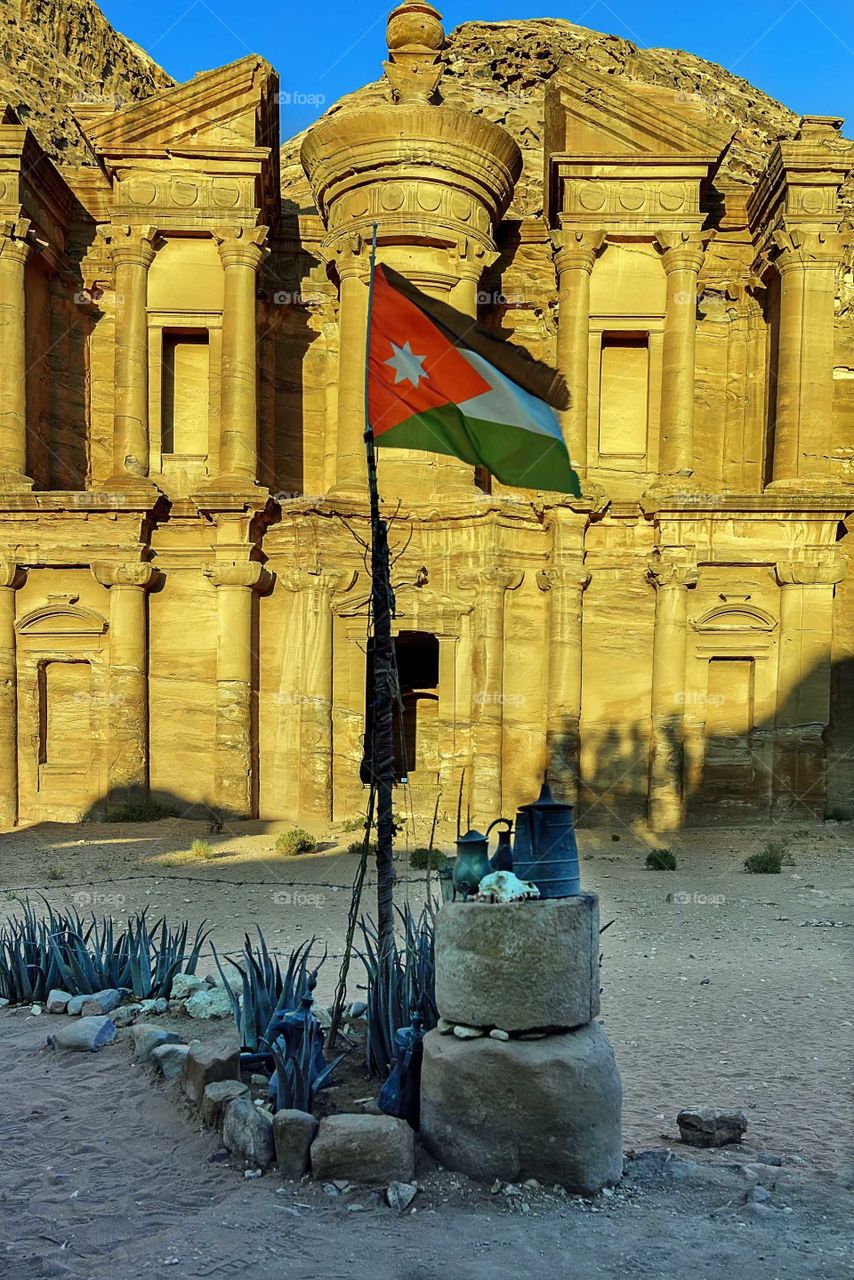Petra monastery with Jordan Flag