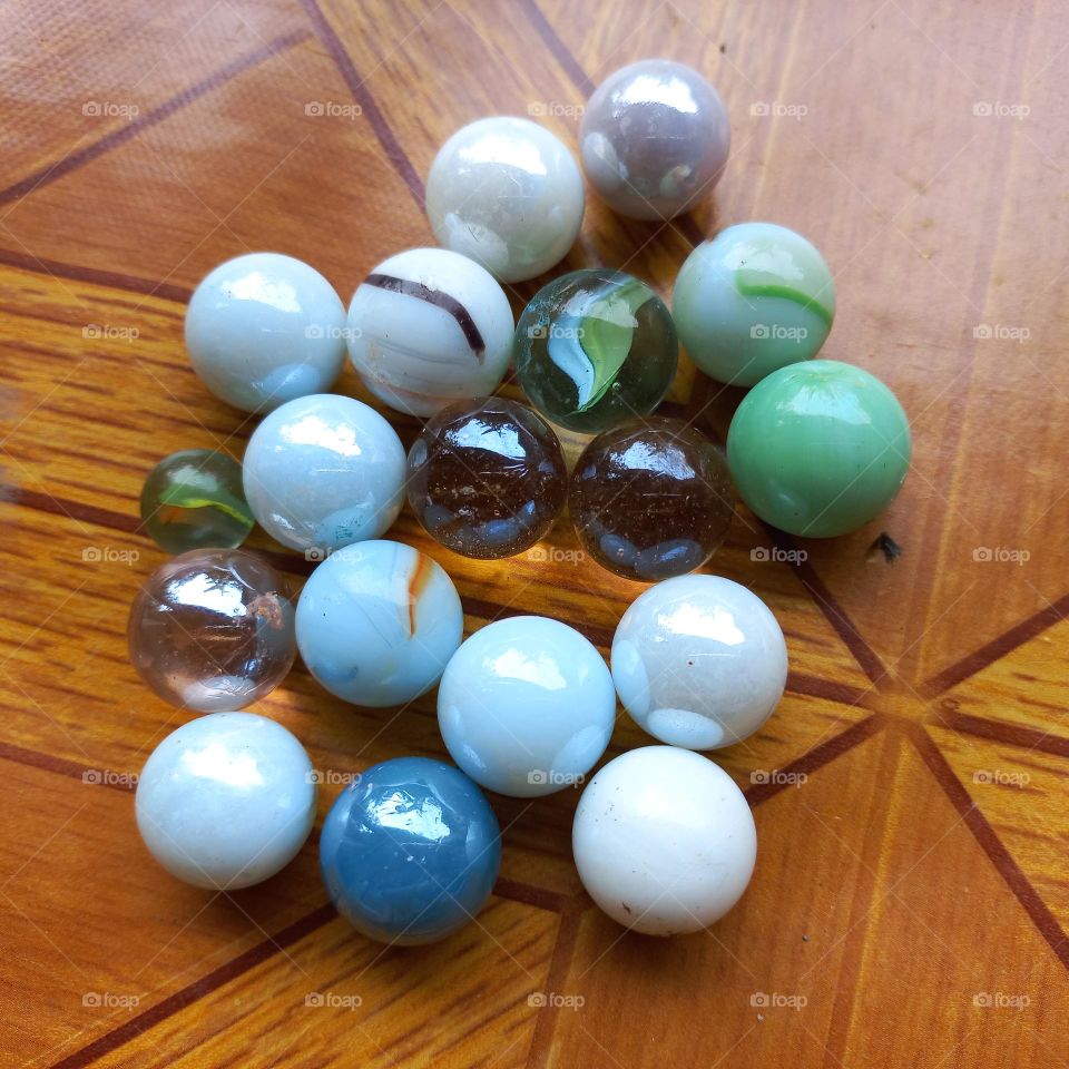 Small balls made of marble or glass clay for children's games