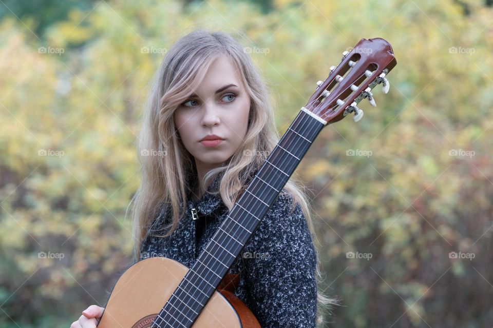 girl playing guitar