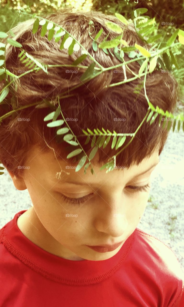 Tree twig on little boy