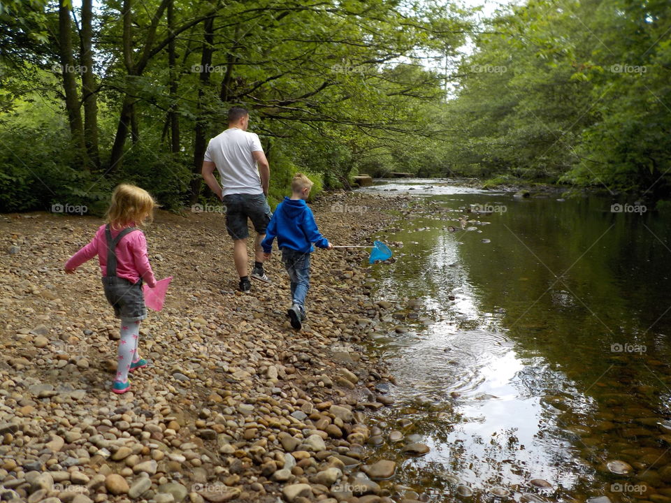Checking out the river with young fisher people 