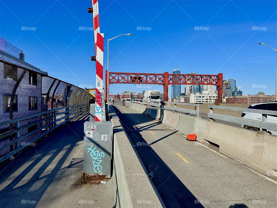 These are the pedestrian and the bicycle lanes of the „Pulaski Bridge“ at „Newtown Creek“ that connects „Greenpoint“, Bklyn to LIC, Queens which is the direction that we are currently facing. 2024. Hypnotic Productions