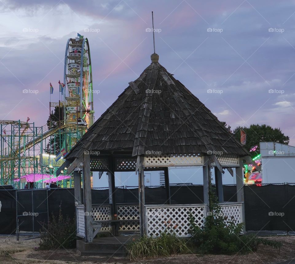 quaint gazebo building outside of a bustling county fair on a Summer evening in Oregon