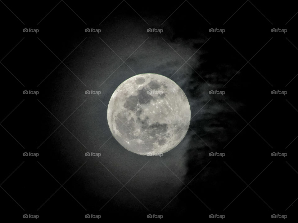 clouds over full moon at night