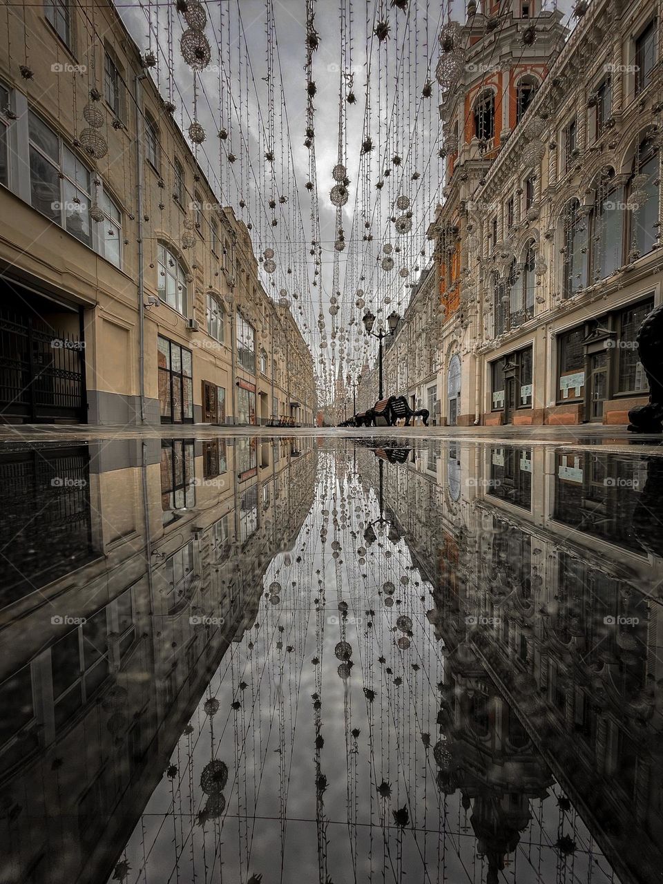 Moscow street and puddle reflection 