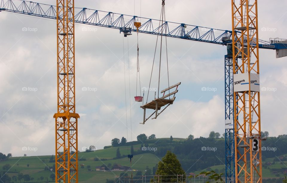 Crane Transporting Workers Seat