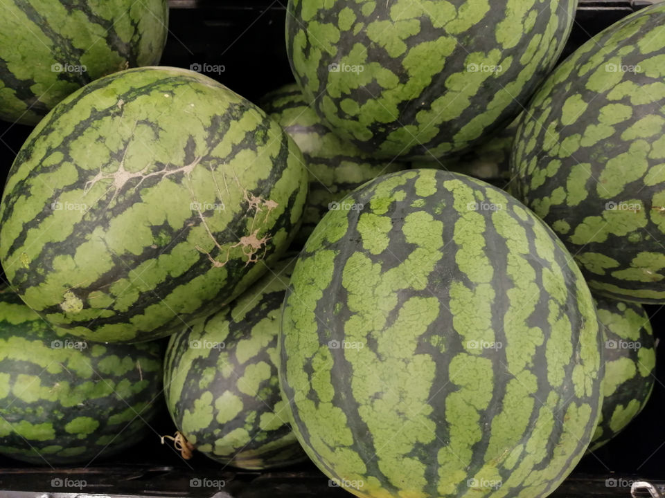 Bulk watermelons in a grocery store