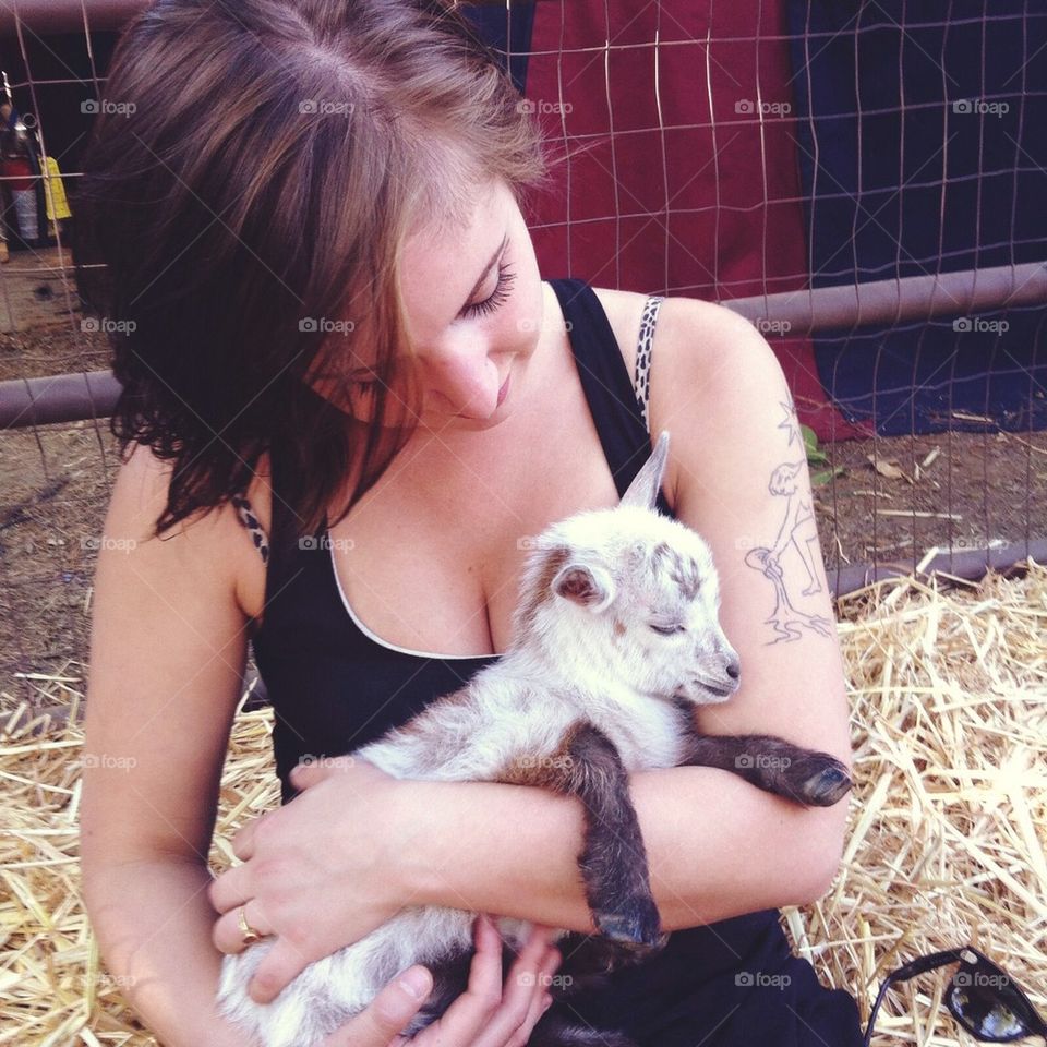 Baby goat cuddles.