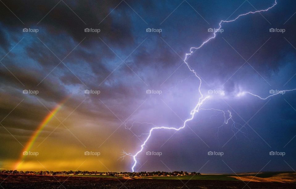 Rainbow with thunderstorms after rain 