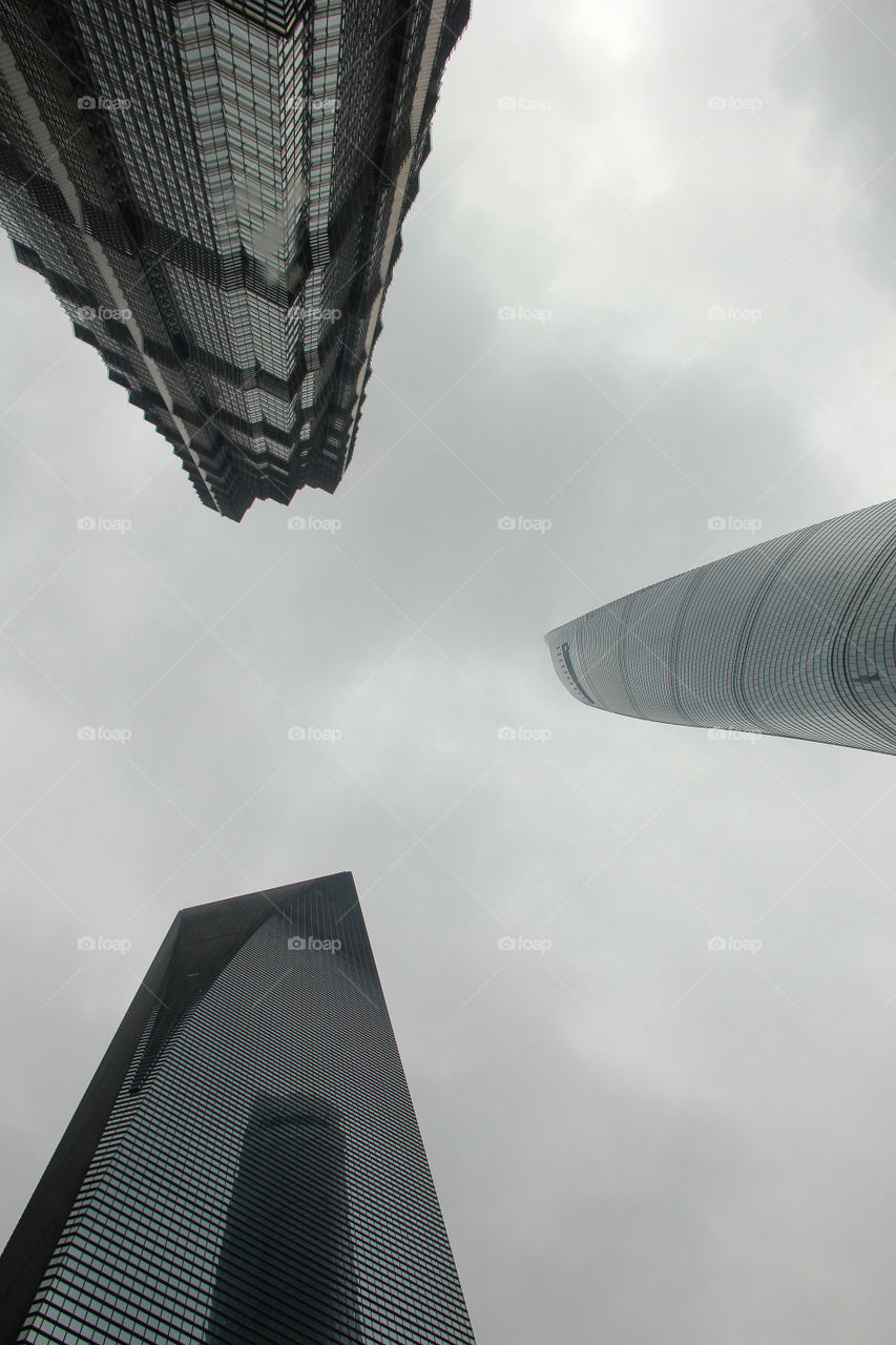 Tall three in Shanghai. Looking up to the three tallest sky scrapers of Shanghai, China.