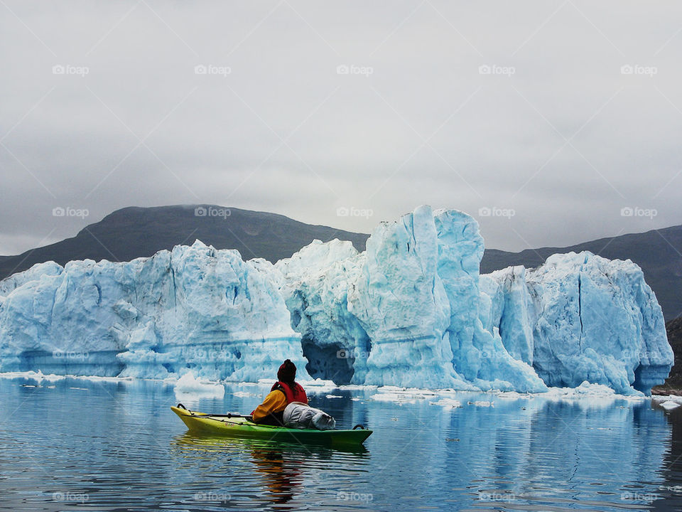 Person on boat looking at glacier