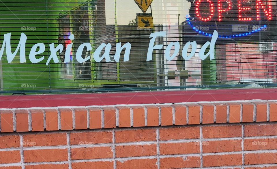 picking up a tasty meal of Mexican food take out from a favorite Restaurant on a Summer evening