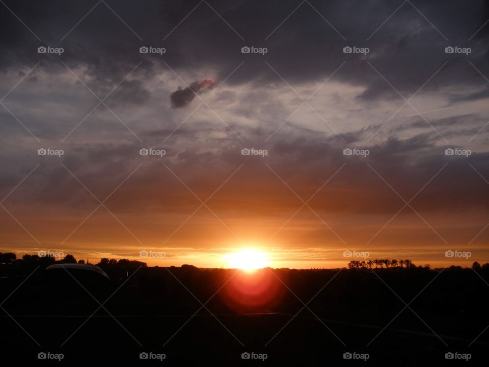 Still a glimpse of the setting sun with a nice reflection in the lens of the camera