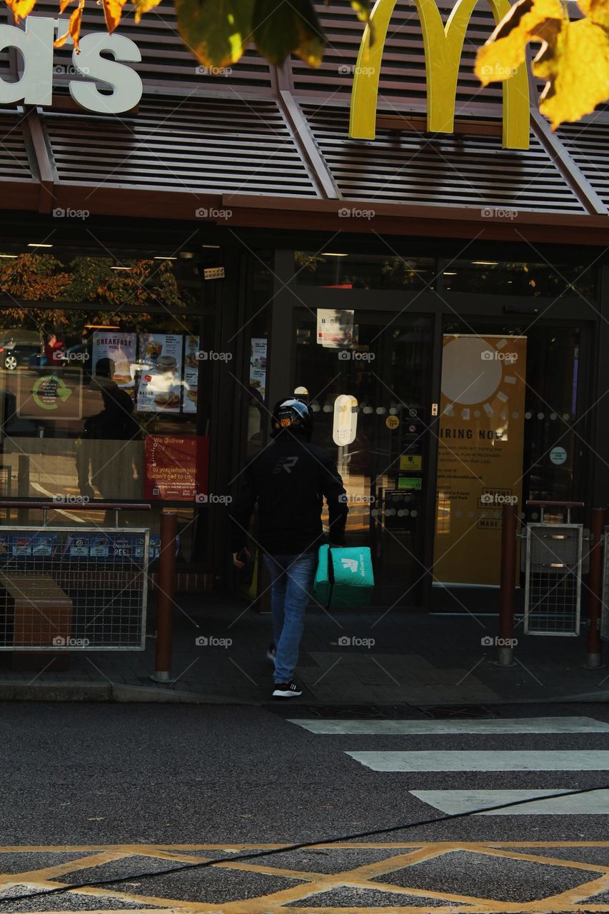 Delivery driver entering a McDonalds