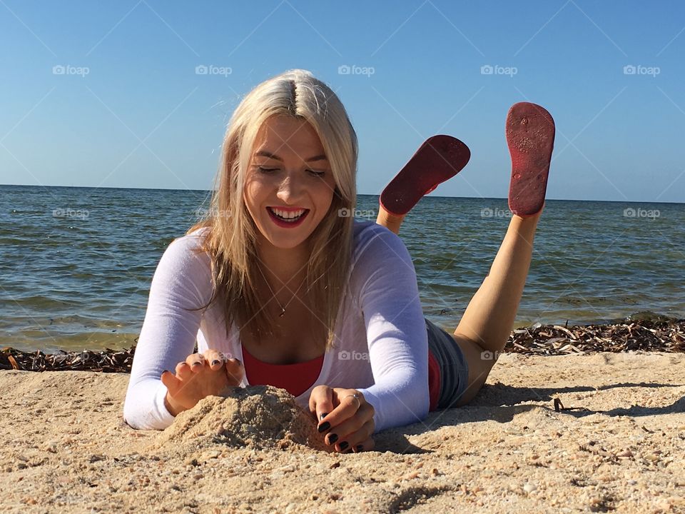 Young woman lying at beach