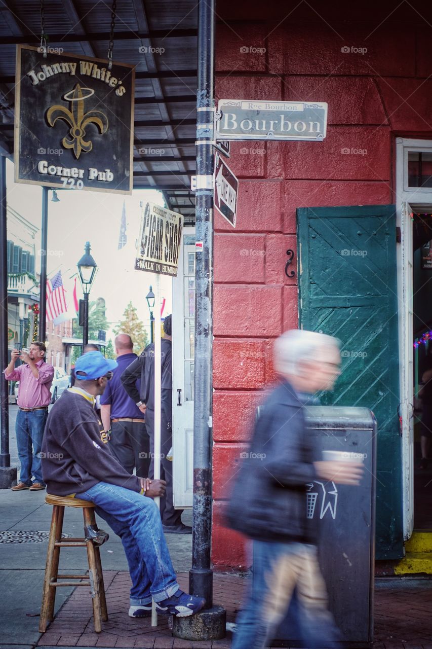 Activities along the famous Bourbon Street. In front of Johnny White's Corner Pub. French Quarter, New Orleans, Louisiana, USA.