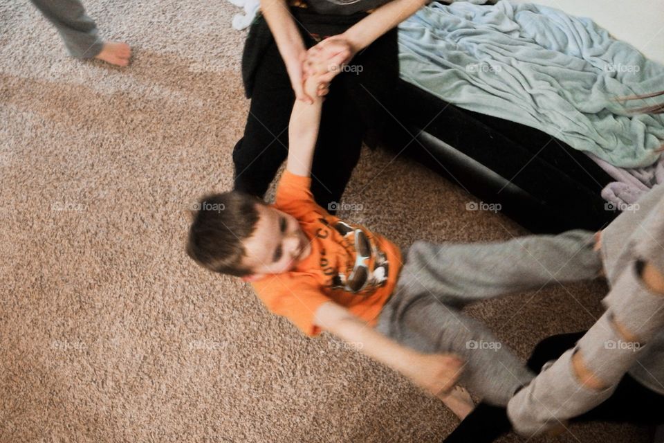 cousins playing indoors