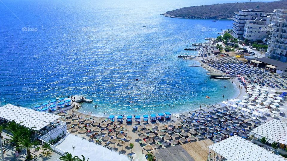 view of the beautiful Ionian sea and a populated beach