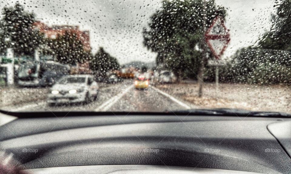 Rain on the road. Rain drivingin my car