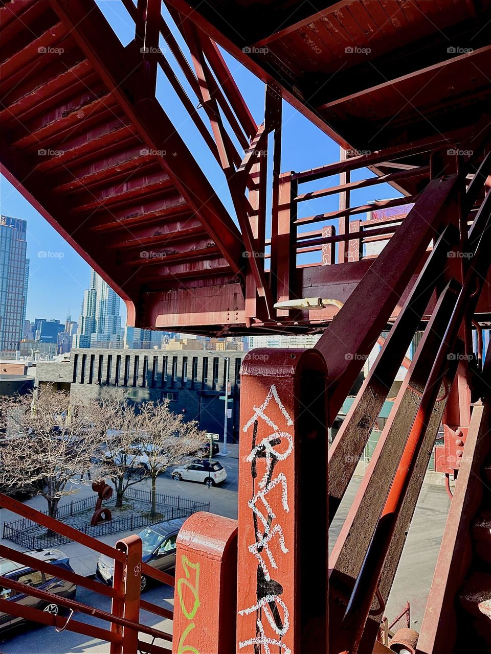 This urban impression comes to us from the “Pulaski Bridge” at “Newtown Creek” on the “Greenpoint”, Bklyn side. The red metal staircase, railings and support beams show a sheer never ending variety of detail. 2023. Hypnotic Productions