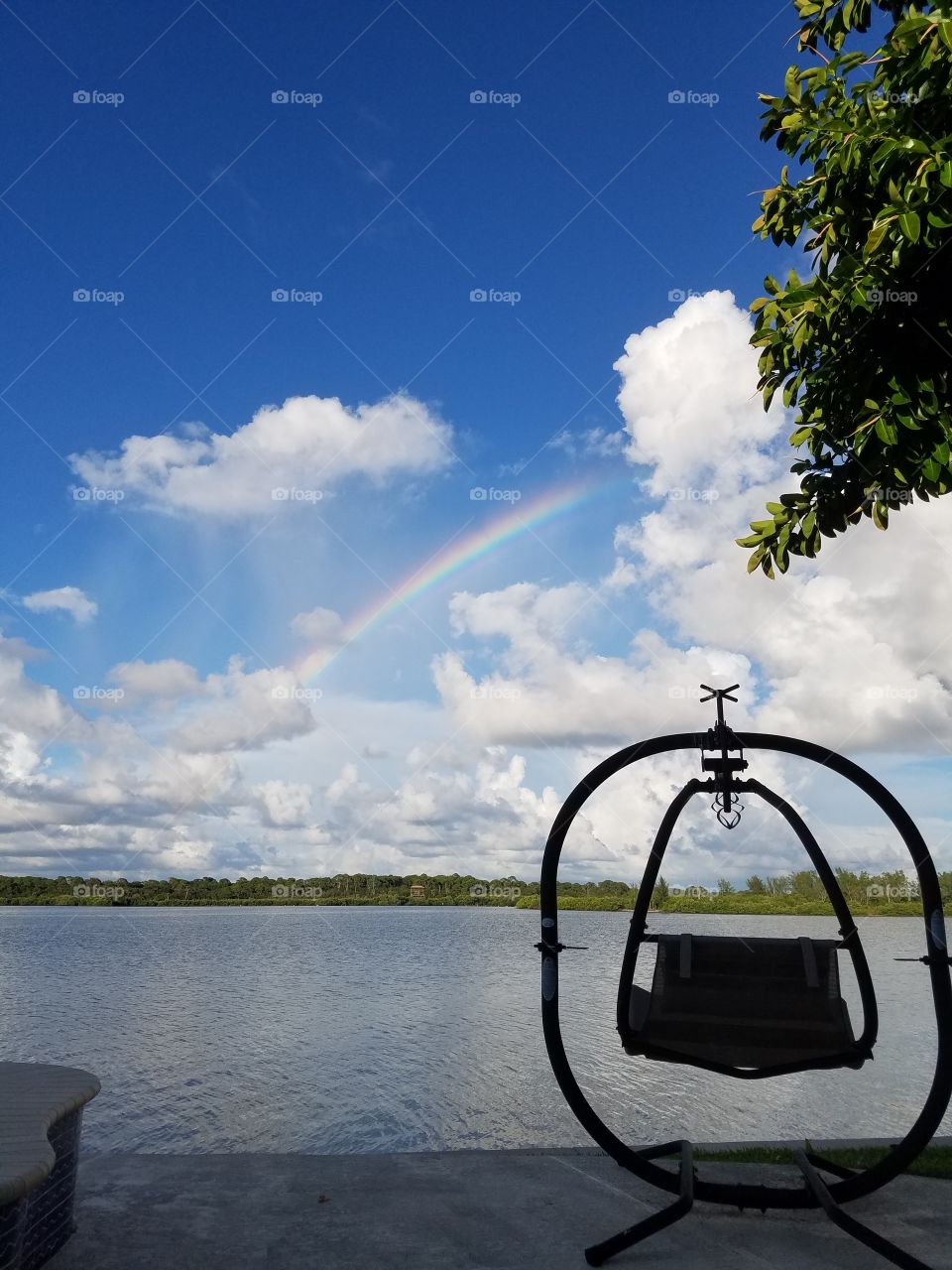 rainbow over a swing