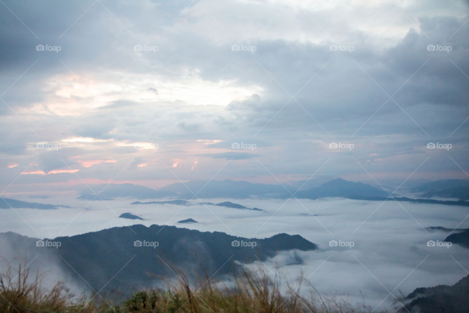 Fog covered the mountain at sea