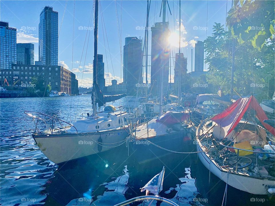 “Newtown Creek” by the “Pulaski Bridge” in LIC, Queens with its many boats looks even more beautiful at the golden hour of sunset. 2023. Hypnotic Productions